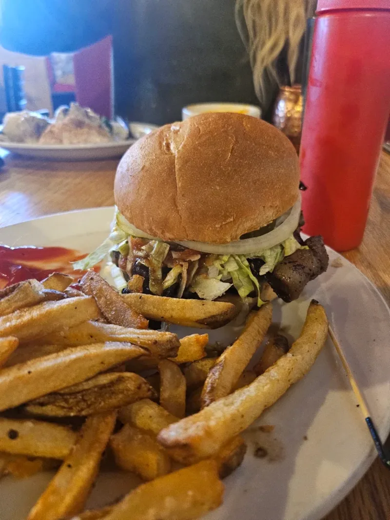 Hand-pattied Killian's burger with lettuce and onion on a toasted bun served with hand-cut fries in Spearfish, SD