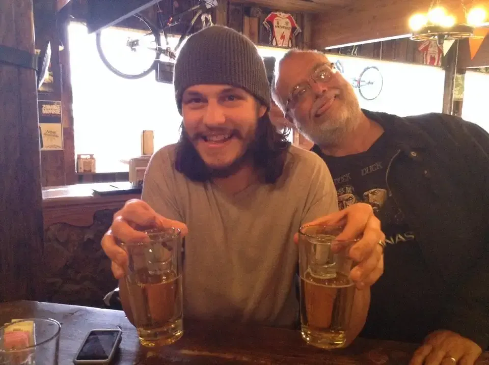 Two friends toasting cocktails during happy hour at Killian's bar in Spearfish, Black Hills